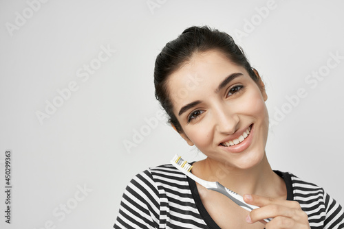 Wallpaper Mural woman in striped t-shirt toothbrush oral care hygiene Torontodigital.ca