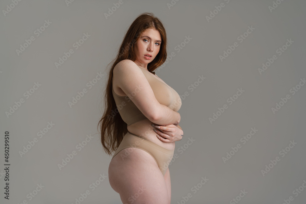 Young white plus size woman in lingerie posing Young white plus size woman in lingerie posing