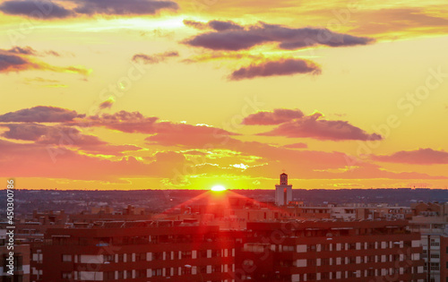 Puesta de sol sobre Madrid en el barrio de Fuencarral (distrito de Montecarmelo), España. Imagen escénica que transmite relajación con colores cálidos. photo