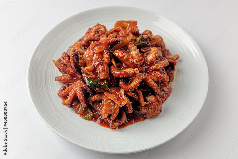 Stir-fried Webfoot octopus on a white background Stir-fried Webfoot octopus on a white background