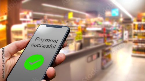 Contactless payment with a smartphone using an online payment service in the grocery store, consumer, online banking, fintech, digitization, internet, contactless payment