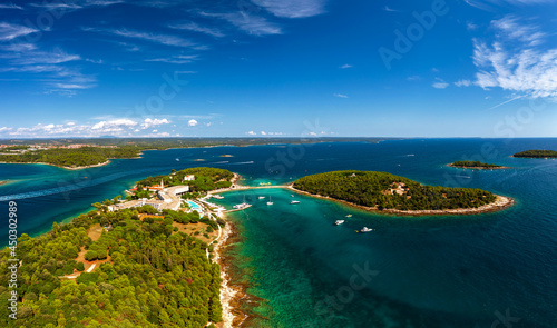 Fototapeta Naklejka Na Ścianę i Meble -  Red island near by Rovinj city in Croatia. Croatian name is Otocic Maskin. It has a hotel, aquapark, chruch monument and amazing beaches