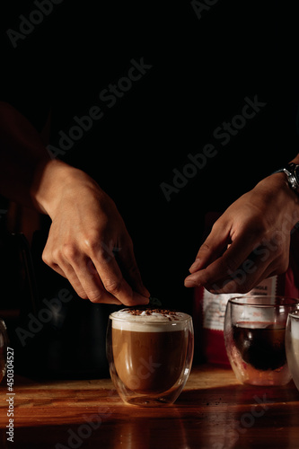 decoring a glass of milk foam beverage