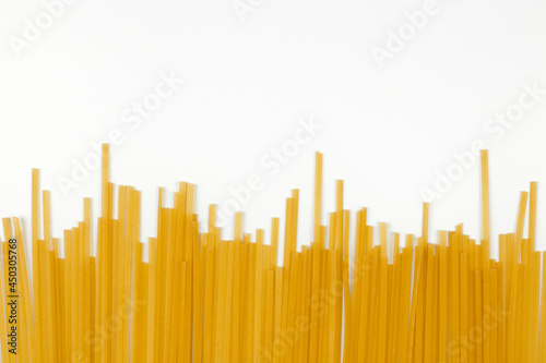 Uncooked spaghetti, bunch of italian pasta photo