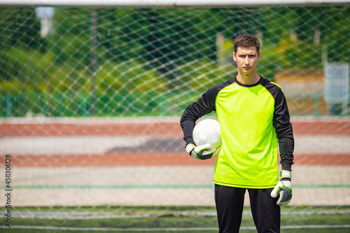 Bild auf Leinwand Portrait man goalkeeper with soccer ball in stadium sport