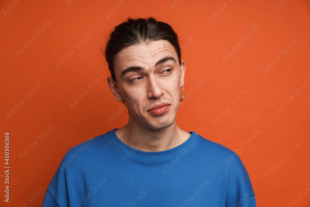 Portrait of a pensive confused young white casual man