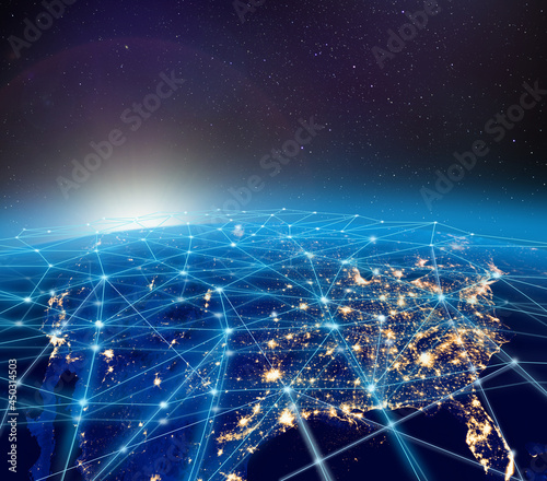 Planet Earth, city lights and worldwide digital network infrastructure concept photo