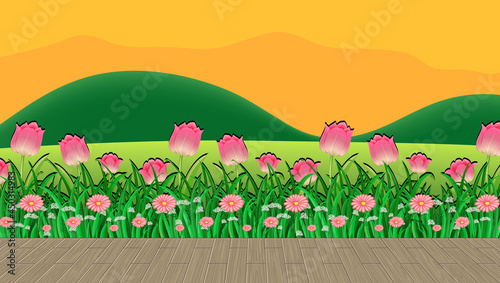 Flower field and green grass with mountain backdrop at sunset time