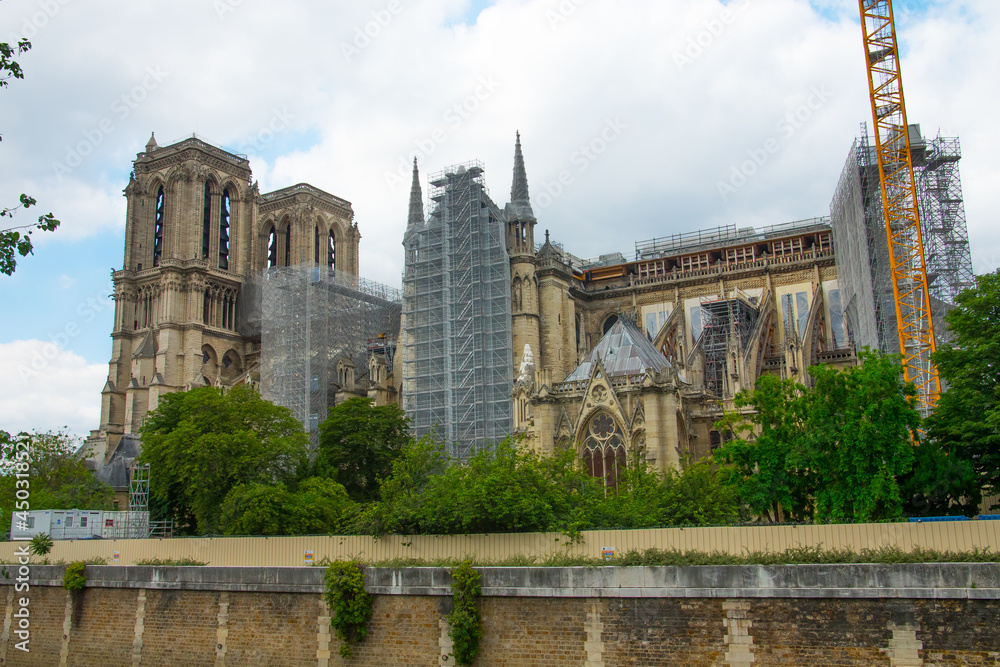 Notre-Dame de Paris cathedral under reconstruction and renovation after the fire of April 2019. Construction Site Of Fire Damaged Building Of Notre-Dame Cathedral Being Rebuilt.