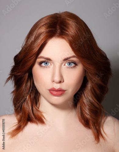 Beautiful red hair woman with healthy skin and hair, fashion glamour portrait of woman with natural make up 