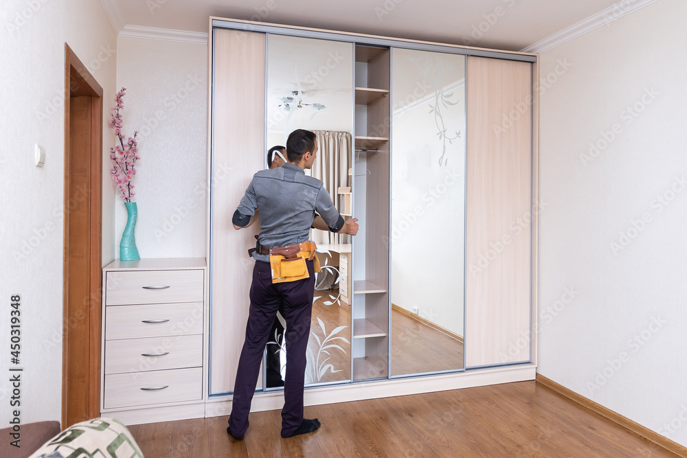 Closet Cabinets Contractor. Finishing Wooden Wardrobe by Professional ...