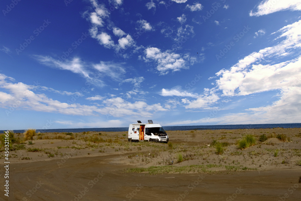 A lone caravan stands in the sand by the sea. Divjaka. Albania. A lone caravan stands in the sand by the sea. Divjaka. Albania.