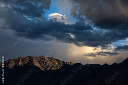 Sunset dramatic sky in Karakorum mountains photo