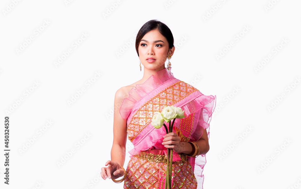 Beautiful girl in White Thai dress with red lotus flowers.Thai girl in retro Thai dress,Beautiful Thai girl in traditional dress costume on a white background in the studio Beautiful girl in White Thai dress with red lotus flowers.Thai girl in retro Thai dress,Beautiful Thai girl in traditional dress costume on a white background in the studio