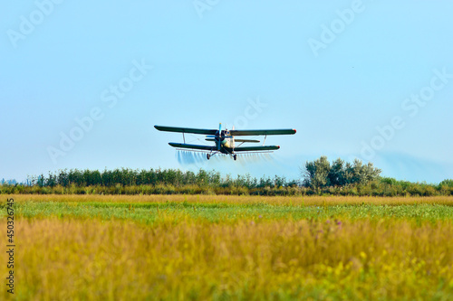 Airplane of agricultural aviation which sprinkles the field from pests