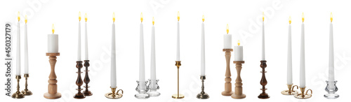 Set of different stylish candlesticks with burning candles on white background, banner design