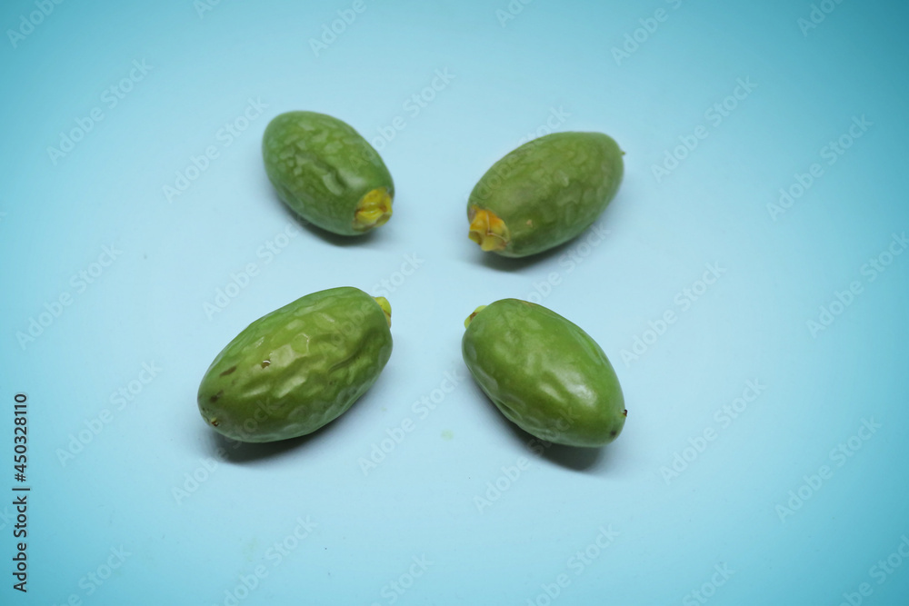 green fresh dates closeup green fresh dates closeup