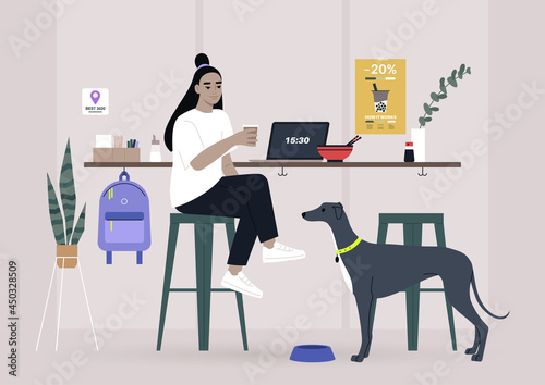 A female Asian freelancer having lunch with their pet in a dog friendly cafe, a counter with bar stools