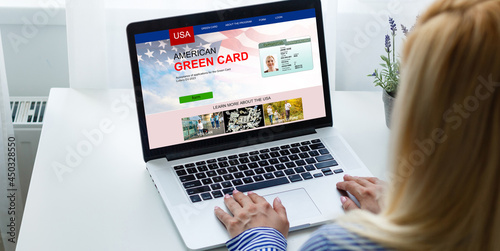 Photography woman with laptop Permanent resident card Green card of USA