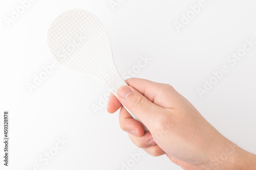 plastic rice paddle on a white background