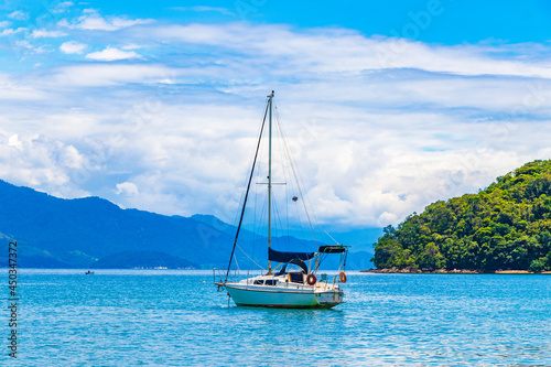 Boats ships and Boat trips Abraao beach Ilha Grande Brazil.