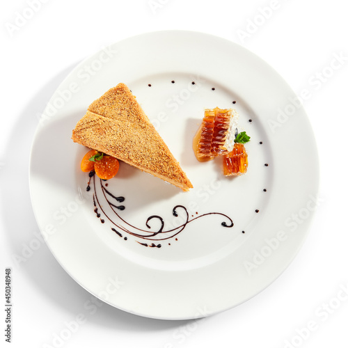 Medovik slice in white plate