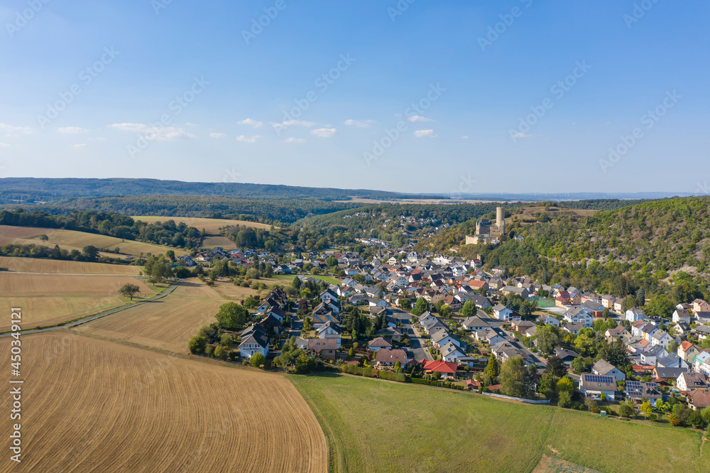 Bird's eye view of the town of Burgschwalbsch / Germany in the Taunus with its imposing castle Bird's eye view of the town of Burgschwalbsch / Germany in the Taunus with its imposing castle