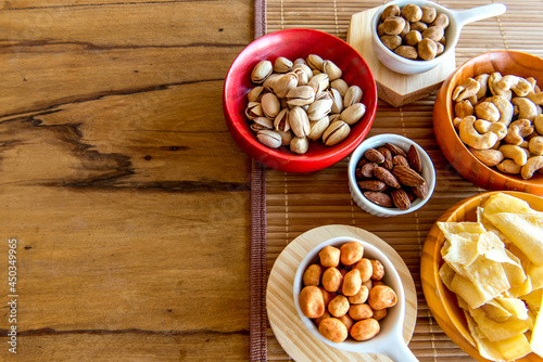 Healthy snack, beans, cassava chips, pistachios, chickpeas, peanuts and almonds.