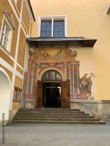 Stainz, Austria, June 23, 2021. Stainz Castle in the Austrian state of Styria. Today the Baroque complex belongs to the Counts of Merano. Entrance to the temple of the former monastery 
