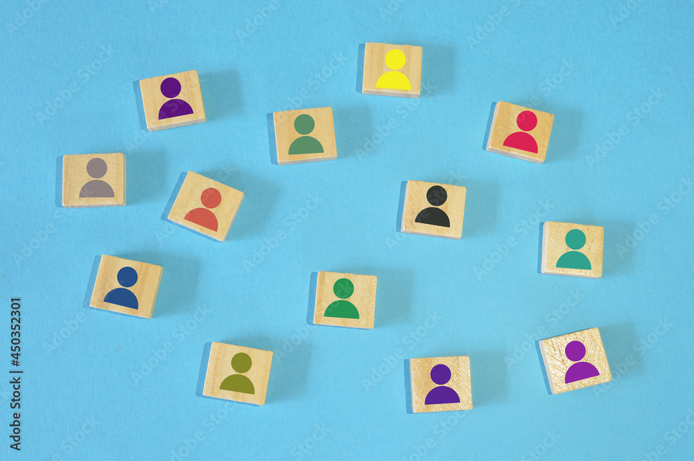 Different color of human symbol on wooden blocks. Different skills and different abilities concept. Different color of human symbol on wooden blocks. Different skills and different abilities concept.