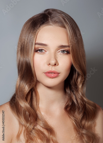 Beautiful portrait of woman with healthy skin and hair and natural make up