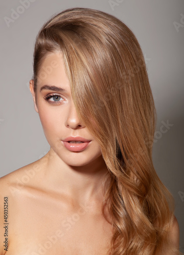 Beautiful portrait of woman with healthy skin and hair and natural make up