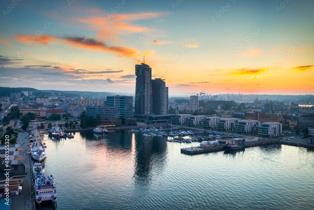 Aerial landscape of the harbor with modern architecture and Gdynia city inscription at sunset. Poland.