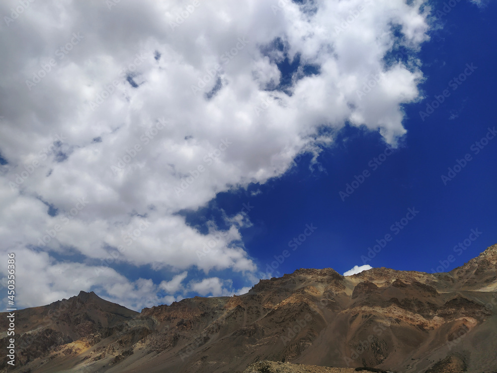 Beautiful red sand and rocky mountain, dark blue sky in leh ladakh, India