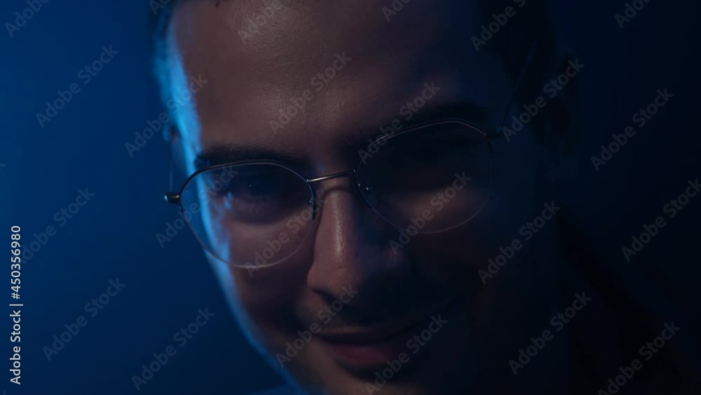 Strange Man Showing a Bitcoin Closeup In Darkness