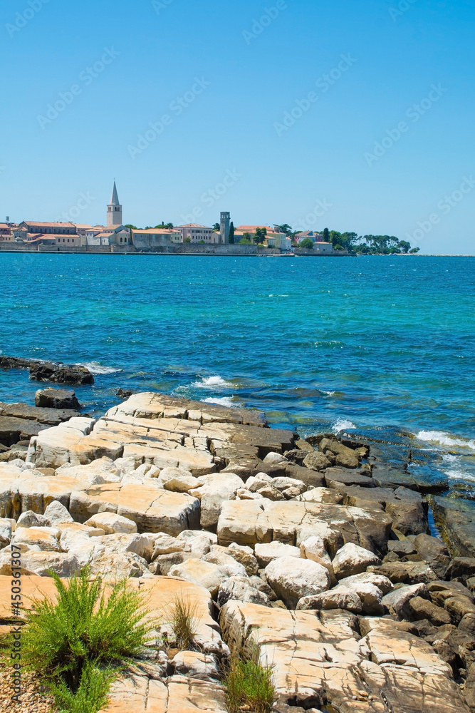 The historic medieval coastal town of Porec in Istria, Croatia, seen from the shore just north of the old town
