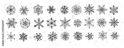 Collection of doodle snowflakes on white background.