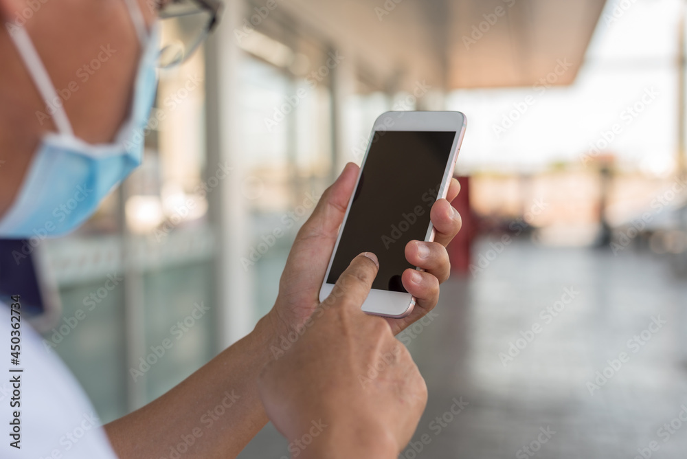 Man hands holding smartphone with blank copy space screen for your text message or information content Man hands holding smartphone with blank copy space screen for your text message or information content