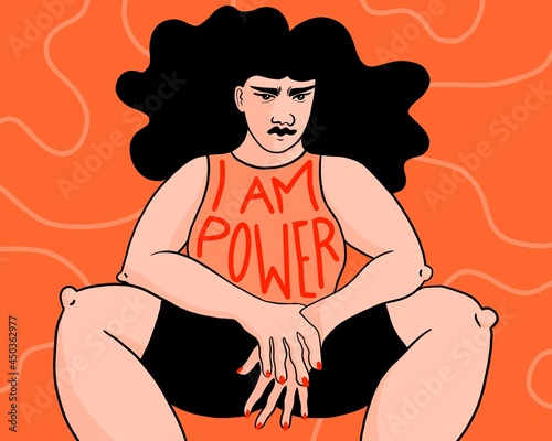 Person sitting with wide legs. I am power on their shirt. 