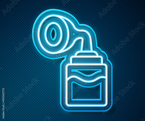 Glowing neon line Breast pump icon isolated on blue background. Vector