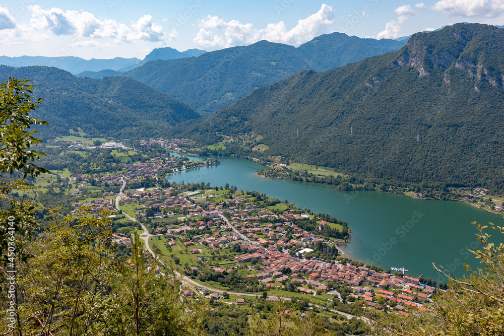 Overview of Lake Idro (province of Brescia, Lombardy), an Italian prealpine lake. The lake is surrounded by wooded mountains. It's a famous place for hiking, camping, cycling, excursion, and relaxing.