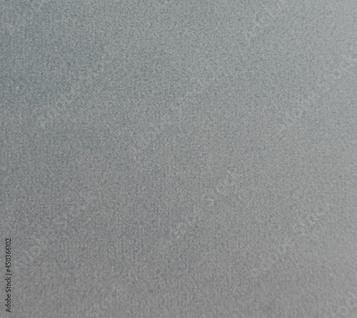 Close up pale grey velvet textured fabric with space for copy