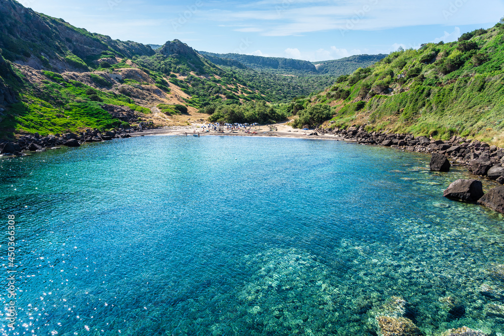 Emerald green see water on coast of Cala Ostina, Sardinia, Italy