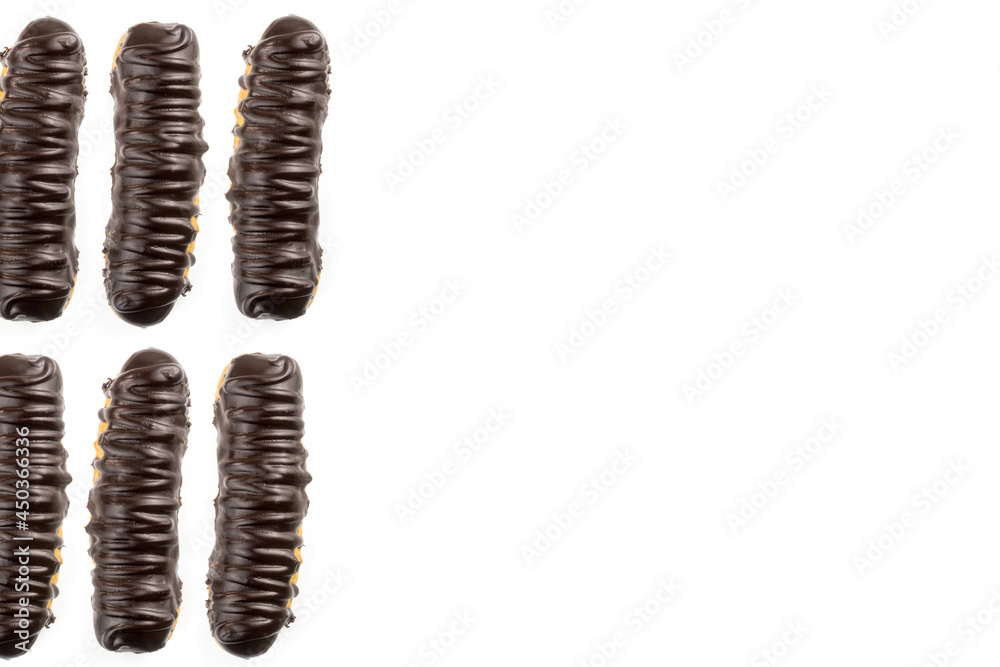 Dessert Bomba de Chocolate. Brazilian traditional éclair on a white background. Selective focus. Top view. Dessert Bomba de Chocolate. Brazilian traditional éclair on a white background. Selective focus. Top view.