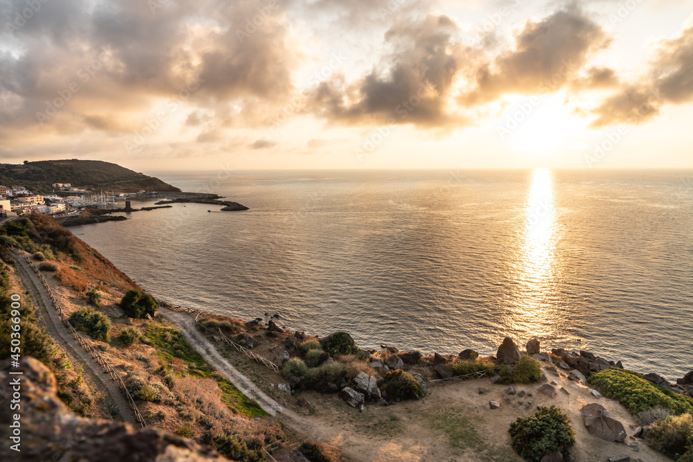 Obraz premium The italian island Sardinia in mediterranean sea at sunset