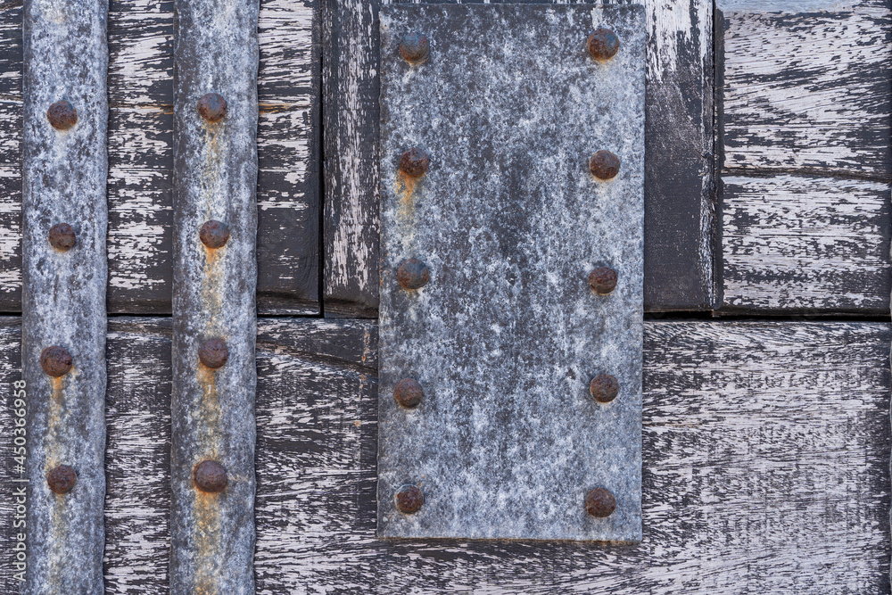 Timber wood light and old metal panels background Timber wood light and old metal panels background