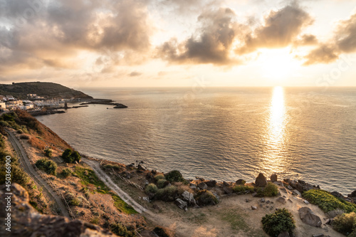 The italian island Sardinia in mediterranean sea at sunset