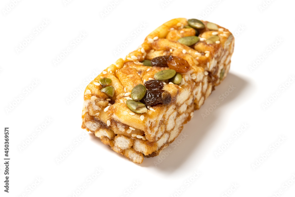 sweet caramel treats with raisins and melon seeds on white background sweet caramel treats with raisins and melon seeds on white background