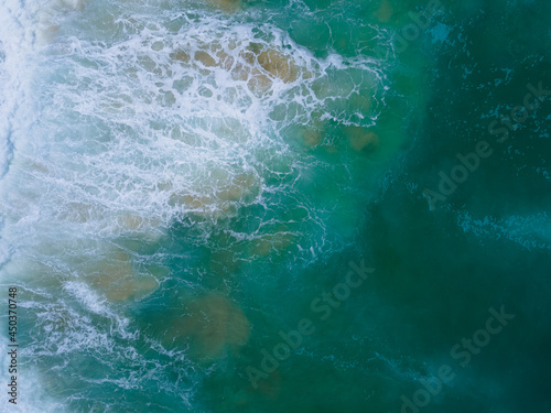 Scene of Beautiful sea waves. Aerial view of drone. Beach sand and sea copy space area. Summer sunset seascape. Phuket Thailand Beach. Water texture. Top view beach sea. Nature and travel concept.