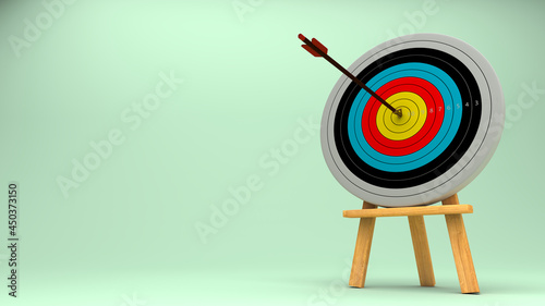 Bow from archery shoot to center point of dart on wood stand.Sport pastel conceptual with 3d realistic rendering.  photo